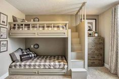 a bedroom with a bunk bed and stairs