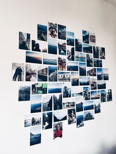 a white wall with many pictures on it