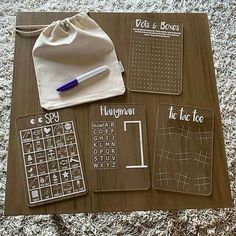 a wooden table topped with lots of different types of writing and paper on top of it