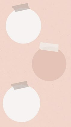 two round objects on a pink background