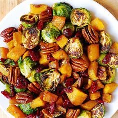 brussel sprouts and brussels sprouts with pecans in a white bowl