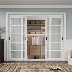 a living room with white furniture and sliding glass doors that lead to the closet area