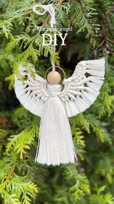 an angel ornament hanging from a tree with the words diy on it