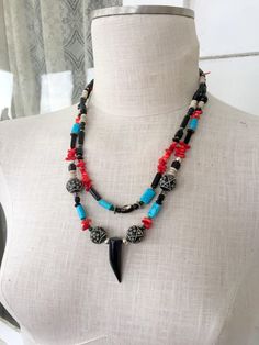 "Here for your consideration is a lovely boho style necklace. It has a mixture of all kinds of beads. Some are turquoise,coral,gemstones,wood,and glass.It measures 22\" around. The pendant at the bottom is glass and is about 1.5\" long. This is in excellent condition. .Free ship to the lower 48 USA only" Beaded Necklace Black, Glass Coral, Beaded Boho Necklace, Turquoise Gem, Boho Style Necklaces, Gem Shop, Gem Stones, Necklace Black, Coral Turquoise