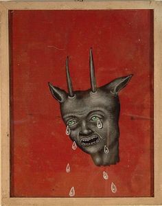 an image of a demon with green eyes and horns on it's head, in front of a red wall