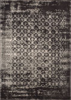 an area rug with black and white designs