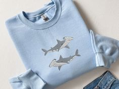 Embroidered Hammerhead Shark Sweatshirt, Funny Hammerhead Shark Shirt, Hammered Sweatshirt, Shark Shirt, Marine Ocean Shirt, Gift for Her, CozyGenZ This Cute & Funny Embroidered Hammerhead Shark Sweatshirt is a great adition to your all season wardrobe. Whether you're running errands, taking a walk outside, or staying cozy at home, this unisex sweatshirt is perfect for you! Our crewnecks are made from the highest quality fabric for an incredibly soft and comfortable fit, with advanced printing t Marine Biology Shirts, Ocean Sweatshirt, Shark Sweatshirt, Ocean Shirt, Bull Shark, Shark Gifts, Shark Lover, Shark Shirt, Hammerhead Shark