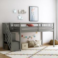 a child's bedroom with a bunk bed and stairs to the second floor is decorated in pastel colors