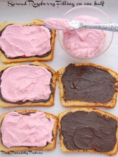 four pieces of bread with chocolate and pink frosting on them next to a bowl of peanut butter