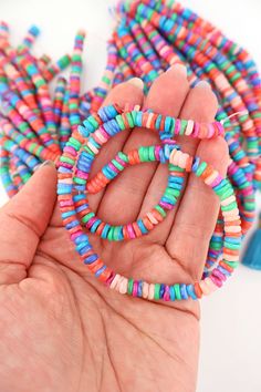 Delightfully bright and colorful, these heishi beads give off strong summer vibes. Their organic heishi shape makes them comfortable against the skin, and perfect for making beach bracelets and neckalces.The DetailsSize: Approx. 6x3mmApprox. Drilled Hole Size: 1mmMaterial: Dyed Mother of Pearl ShellColors: Assorted shades of Pink, Coral, Green, Blue, PeriwinkleStrand Length: 15.5"❤️✌🏽❤️✌🏽❤️✌🏽❤️All content (which includes all text, photography, product names, product descriptions) is All right Bohemian Heishi Letter Beads, Hand-strung Heishi Beaded Necklaces For Beach, Hand-strung Heishi Beads Necklace For Beach, Multicolor Heishi Beaded Bracelets For Vacation, Colorful Heishi Letter Beads, Multicolor Heishi Beads With Heart Details, Colorful Heishi Beads Jewelry For The Beach, Multicolor Heart Beads For Beach, Heishi Heart Beads For Jewelry Making