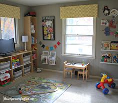 a child's playroom with toys, bookshelves and other items in it