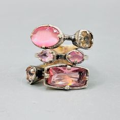 Elevate your style with this stunning Dyrberg & Kern ring, featuring a beautiful array of sparkly multi-pink stones. Designed by the Danish duo, this vintage piece is marked with the 'II' symbolizing size two, with an inner diameter of 17.2 mm, EU ring size 54, and US size 7. In good vintage condition, but note there are areas on this ring where the silver is fading and copper is showing through please see pictures. Add a touch of Danish sophistication to your collection. Danish Rings, Pink Stone, Multi Stone, Multi Stone Ring, Danish Design, Stone Rings, Color Pop, Copper, Sparkle