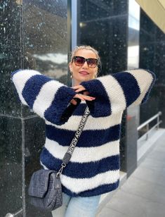 Striped Mohair Sweater Navy Blue and White, Step into style with our women's striped sweater. The classic navy blue and white stripes offer a timeless look, making it a versatile addition to any wardrobe. 🌟 Experience the softness and comfort of our oversized nautical pullover. The mohair blend provides warmth without the weight, ideal for staying cozy on cooler days. 📏 Size for Every Woman: Available in multiple sizes, our sweater is designed to flatter every figure. Consult our sizing guide Oversized Winter Sweater With Contrast Stripes, White Knit Sweater With Horizontal Stripes, Oversized Striped Cozy Sweater, Casual Winter Sweater With Vertical Stripes, Cozy Oversized Striped Sweater, Navy Casual Sweater With Contrast Stripes, Blue Crew Neck Sweater With Horizontal Stripes, Nautical Long Sleeve Sweater For Fall, Nautical Long Sleeve Sweater For Winter