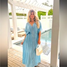 Santorini Cover Up Dress - Dusty Blue. Stunning Romantic Vibes Maxi Bathing Suit Cover! This Maxi Length Cover-Up Dress Features Intricate Lace Details And Kimono Style Sleeves, With An Elastic Waistline For A Comfortable Fit. The Side Slits Provide Flexibility And Movement While Maintaining A Modest And Sophisticated Style. Lightweight And Pertect For A Day In The Sun. Fit Is True To Size Tor A Relaxed Fit, Model Is In A Small. 100% Polyester Blue Maxi-length Cover-up For Vacation, Elegant Blue Maxi Dress For Beach Cover-up, Blue Maxi Length Beach Season Cover-up, Blue Summer Maxi Dress For Beach Cover-up, Flowy Blue Maxi Length Cover-up, Romantic Vibes, Bathing Suit Cover, Bathing Suit Covers, Kimono Style