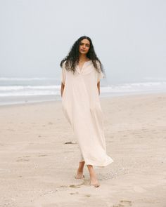 Indulge in effortless elegance with our Women's Gauze Caftan Maxi Dress. Crafted from airy and soft muslin gauze fabric, this dress exudes summer and unparalleled comfort. Embrace free-spirited style with its flowy silhouette and relaxed fit, perfect for lounging at the beach or strolling through summer markets. Elevate your wardrobe with this versatile piece, ideal for both casual outings and special occasions. Discover the epitome of laid-back luxury with our Gauze Caftan Maxi Dress. soymilk - Beige Tunic Dress For Loungewear, Beige Summer Dress For Loungewear, Beach Dress With Natural Dye And Short Sleeves, Short Sleeve Beach Dresses With Natural Dye, Relaxed Summer Dress For Daywear, Breezy Flowy Loungewear Dress, Cream Maxi Dress For The Beach, Cream Flowy Maxi Dress For Beach, Summer Flowy Dresses With Natural Dye