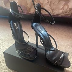 Black Heels , Never Worn. Sleek Open Heel Heels For Night Out, Black Heels With 4-inch Heel And Ankle Strap, Sleek High Heel Shoes For Date Night, Sleek High Heels For Date Night, Round Toe Heels With Heel Loop For Night Out, Sleek Heels With Padded Heel For Night Out, Sleek Heels With Heel Loop For Night Out, Sleek Black Open Toe Heels, Sleek High Heels For Night Out