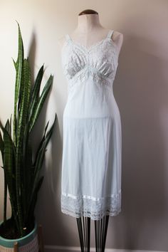 Vintage Lace Nightgown For Sleep, Vintage Nightgown With Delicate Lace For Wedding Night, Vintage Lace Sleepwear, Vintage Lace Nightgown For Loungewear, Vintage Sleeveless Slip Dress For Loungewear, Bedtime Lace Slip Dress With Lace Trim, Vintage Lace Sleepwear For Bedtime, Vintage Nightgown With Lace Trim For Bedtime, Vintage Lace Sleepwear For Home