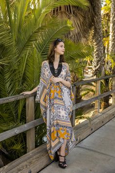 This lovely mixed print caftan is the answer to glam layering. Made with luscious yards of opaque scarf print machine washable chiffon and lots of love. Bohemian splendor, handmade in California. One size fits most. Bohemian Chiffon V-neck Cover-up, Bohemian Multicolor Chiffon Maxi Dress, Bohemian Printed Tunic Maxi Dress, Bohemian Printed Maxi Length Kimono, Bohemian Maxi-length Printed Kimono, Bohemian Maxi Length Printed Kimono, Bohemian Printed Dresses With Kimono Sleeves, Bohemian Printed Dress With Kimono Sleeves, Bohemian Dress With Printed Kimono Sleeves