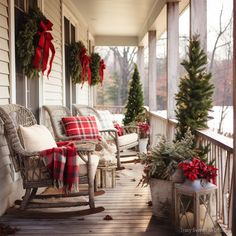 the porch is decorated for christmas with red and white plaid pillows, evergreen garlands, and wreaths