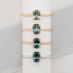 * One of a kind ring (Choose between 4 different rings) * Ring details: No.1 Yellow Gold: 0.69ct Oval Cut Montana Sapphire Parti Aqua Green 6.48x4.43x2.72mm Heated Center stone clarity: vs1-some inclusion visible under x10 loupe and slightly visible on close eye inspection but does not affect the brilliance of the stone. No.2 Yellow Gold: 0.73ct Oval Cut Montana Sapphire Blue Green 6.45x4.57x2.9mm Center stone clarity: vs1-some inclusion visible under x10 loupe and slightly visible on close eye inspection but does not affect the brilliance of the ston No.3 Rose Gold: 0.78ct Blue Green Montana Sapphire, 6.49x4.53x3.09mm, heated, vs1-some inclusion visible under x10 loupe and slightly visible on close eye inspection but does not affect the brilliance of the stone. No.4 White Gold: 0.8ct Blue Oval Green Sapphire Ring, Sapphire Engagement Ring Simple, Blue Green Sapphire Ring, Engagement Ring Simple, Oval Sapphire Engagement Ring, Montana Sapphire Engagement Ring, Ivory Ring, Green Montana, Grey Sapphire