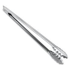 two metal tongs sitting on top of each other