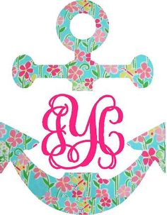 the monogrammed anchor has pink flowers on it and is painted in bright colors