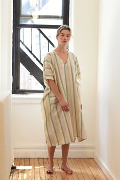 Crafted on the coast of Turkey, our Green Ivory Montauk V-Neck Kaftan is hand loomed using traditional techniques and woven with 100% premium Turkish cotton. Similar to a Turkish towel, it is highly absorbent, lightweight, eco-friendly, and quick to dry. A beautifully breezy loose fitting dress that will perfectly compliment your seaside apparel. Care - Wash twice before use to soften. Machine wash cold. Tumble dry low or line dry. Your tunic will become softer and more luxurious with wear! Size Cream V-neck Kaftan, Fitting Dress, Loose Fitting Dresses, Hand Loom, Turkish Towels, Traditional Techniques, The Coast, Handmade Natural, Loose Fitting