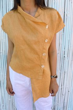 "DETAILS:- - Asymmetric Linen Shirt - Cowl Neck - Designer collar with Shell Buttons - 100% Lightweight Linen - Customization Available For more products here is the link to my shop ---------------------------------------- https://www.etsy.com/in-en/shop/PehroDesign ---------------------------------------- ★★All the outfits are MADE TO ORDER you can share your demand for any kind of changes before placing your order ★★ ----------------------------------------------------- ★★ Very Comfortable Fab Linen Top Women, Linen Tunic Dress, Blouse Summer, Dress Asymmetrical, Simple Top, Cowl Neck Top, Linen Blouse, Linen Top, Asymmetrical Hem