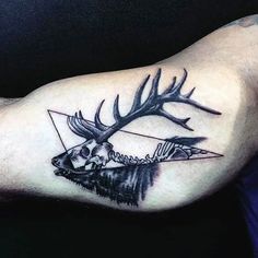 a man with a deer tattoo on his arm