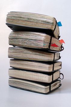 a stack of books sitting on top of each other