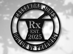 a black and white photo of the logo for rx est 2055, which is located