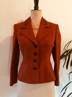 "A very high quality and beautifully made ladies suit jacket. I am unsure of the vintage of the jacket, but it does have a 1940s - 1950s look to it (although it is more recent than this). The jacket is made from a lovely rich russet coloured wool, and is fully lined.  The brand name is 'Windsmoor of England'. The jacket has contrasting black buttons and black embroidery on the collar.  ------------------------------------------------ Measurements: Bust at underarm: 37\"- 38\" Waist: 29\" Hem: 40\" Length from centre back neck to hem: 23\" (measured from neck seam downwards, so excluding the collar) Cross shoulder measurement: 16\" Overarm length: 23¼\" Condition: excellent, no damage -------------------------------------------------- As with all vintage and antique items, these are second 1940s Jacket Women, Vintage Capsule Wardrobe, 1940s Coat, Vietnam Clothes, 1950s Look, 1940s Jacket, 1940s Suit, 1940s Woman, Ladies Suit