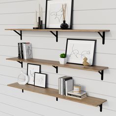 two wooden shelves with pictures and books on them