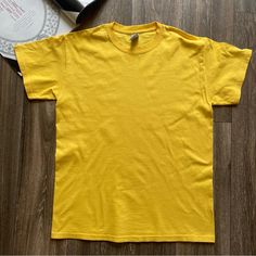 Gildan Adult Thick Heavy Cotton T-Shirt Daisy Yellow Size: M New Without Tags. Washed, Never Worn. Measurements Approx: Shoulder: 18” Shoulder To Hem: 27” Chest: 39” Weight: 5.5 Oz Material: 100% Cotton Made With Sustainably And Fairly Grown Usa Cotton Seamless Rib At Neck Taped Shoulder-To-Shoulder Double-Needle Stitching Throughout Classic Fit Please Contact Us With Any Questions Prior To Buying, Check Over All Measurements And Pictures. Smoke& Pet Free Environment. We Wrap, Protect, And Pack Tan Pre-shrunk T-shirt With Crew Neck, Casual Solid Yellow Shirt, Pre-shrunk Tan T-shirt With Crew Neck, Yellow Short Sleeve Top, Yellow Cotton Top, Yellow Relaxed Fit Solid Color Tops, Basic Yellow Pre-shrunk Tops, Tan Crew Neck Top, Yellow Casual Solid Color Shirt