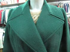 "Awesome original 70s doublebreasted coat. Mod coat. Tailored made. Gorgeous deep green colour. It features a big collar with wide lapels (pic.2). Flared and topstitched on low waist (pic.3). No pockets. Fully lined. No label for fabric but it's doubtless good and solid wool. Mint conditions. It fits size M about 10 US Measurements: (lay flat and double chest) Shoulders 15.7\" chest 39.3\" sleeve length 23.2\" back length (from neck bottom to hem) 40\" Bellissimo cappotto verde scuro anni 70. Fa Waist Pic, Big Collar, Green Wool, Green Colour, Low Waist, Deep Green, Pocket Size, Wool Coat, Flare Pants