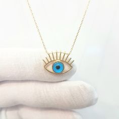 - Eye Evil Eyelash Pendant Necklace is made with high quality 14K real solid yellow gold. - Eye Evil Eyelash Pendant Necklace for women is decoreted with blue evil eye Stone. Evil Eyes are also called Turkish Greek Evil Eye, Faith Protection and Nazar. - This cute, charm, dainty, delicate, elegant women jewelry Eye Evil Eyelash Pendant Necklace has been artfully designed for timeless yet modern millennial fashion. - You receive the necklace in a beautiful and free gift box - Free shipping (Arriv Luxury Evil Eye Pendant Jewelry, Evil Eye Pendant Jewelry For Good Luck, Elegant Evil Eye Pendant Jewelry, Evil Eye Stone, Blue Metal Necklace With Evil Eye, Blue Metal Evil Eye Necklace, Eye Piercing, Lucky Jewelry, Evil Eye Necklace Gold