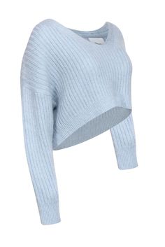 Fuzzy and fashionable, this soft sweater from 3.1 Phillip Lim is a cozy-chic winter essential! Crafted from a luxurious wool and mohair blend in baby blue, this V-neck is both snuggly and stylish. Pairs perfectly with jeans and booties for a comfy-cute look. Size XS Wool 57%, Polyamide 23%, Mohair 20% Pullover V-neck Ribbed knit Drop shoulder Fuzzy texture from Mohair Bust 45" Waist 39" Shoulder to hem 17.5" Sleeve length 19" Chic Cashmere Cropped Sweater For Winter, Chic Winter Cashmere Cropped Sweater, Chic Winter Cropped Cashmere Sweater, Soft Textured Blue Sweater For Winter, Chic Blue Sweater For Loungewear, Cozy Blue Fine Knit Sweater, Chic Blue Soft Knit Sweater, Blue Cozy Cropped Sweater In Soft Knit, Cozy Blue Cropped Soft Knit Sweater