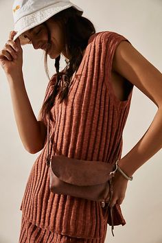 So simple and essential, this go-with-everything leather crossbody bag is the perfect compact place to keep your necessities. **Features:** Crossbody style, compact design, leather fabrication, flap and zipper closure, adjustable shoulder strap, tassel detail **Why We | We The Free Rider Crossbody Bag at Free People in Brown Easy Bag, Free People Bags, Leather Sling Bag, Leather Harness, Simple Bags, Music Festivals, Swimwear Tops, Cow Leather, Boho Outfits