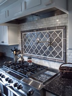 a stove top oven sitting inside of a kitchen