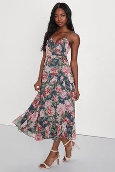 Stroll into the party with confidence, 'cause no on will be able to match your look in the Lulus Delightfully Divine Navy Blue Floral Chiffon Wrap Midi Dress! Airy woven chiffon, with a romantic floral print throughout, falls from adjustable spaghetti straps to form a surplice bodice with long sash ties that thread and secure around the waist. Skirt has an overlapping silhouette and falls to a flirty midi hem. Fit: This garment fits true to size. Length: Mid-calf length. Size medium measures 44. Spring Party Sundress In Chiffon, Dressy Floral Print Party Maxi Dress, Dressy Floral Print Maxi Dress For Date Night, Flowy Floral Print Chiffon Party Dress, Flowy Floral Chiffon Party Dress, Feminine Summer Chiffon Dress For Date Night, Chiffon Sundress For Party, Chiffon V-neck Midi Dress For Date Night, Summer Fitted Chiffon Dress For Wedding Guest