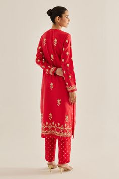 Red kurta with thread, floral, dori embroidery. Paired with trousers and dupatta.
Components: 3
Pattern: Embroidered
Type Of Work: Floral
Neckline: Round
Sleeve Type: Full
Fabric: Silk Chanderi
Color: Red
Other Details: 
Side slits
Placket detailing
Length (In inches):
Kurta: 48
Trouser: 38
Occasion: Puja - Aza Fashions Dori Embroidery, Red Kurta, Kurta Set For Women, Types Of Work, Fabric Silk, Kurta Set, Red Silk, Set For Women, Aza Fashion