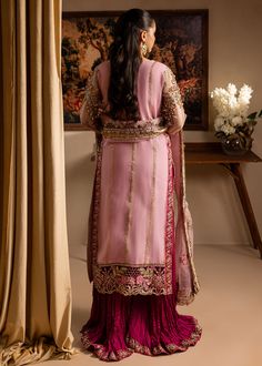 Brand: Maria Osama KhanCollection: Lamhay by Maria Osama Khan Wedding Festive Edition Fabric: Organza Description: Embroidered and hand embellished front open shirt (appliqued neckline ,sleeves, and shirt panels) Paired with crushed gharara and embroidered dupatta. Color: Pink Fabric Detail: Shirt: Organza Trouser: Pk.Rawsilk Dupatta: Organza Price Includes: Shirt Sharara Dupatta DISCLAIMER:* Lining, Laces, and Tassels are not included in unstitched variants.* Embellishment items in stitched out Hand Embellished Anarkali Unstitched Suit For Wedding, Bollywood Style Hand Embellished Unstitched Wedding Suit, Bollywood Hand Embellished Unstitched Suit For Wedding, Unstitched Embellished Traditional Sets, Hand Embellished Anarkali Raw Silk Set, Anarkali Hand Embellished Pink Salwar Kameez, Traditional Embellished Unstitched Suit For Reception, Traditional Hand Embellished Chinon Salwar Kameez, Festive Anarkali Unstitched Suit Hand Embellished