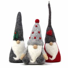 three gnomes are sitting next to each other