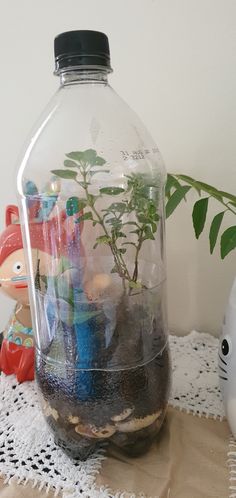 a glass jar filled with lots of small toys