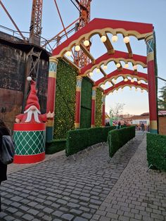 the entrance to an amusement park decorated for christmas