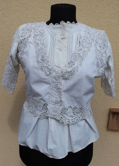 Antique Hungarian white vest with blouse hand embroidered S size If you are buying several pieces I can combine postage at the time of mailing. If you have any question please don't hesitate to contact me, My etsy shop: https://www.etsy.com/shop/TreasuryCoffer Floral Peasant Blouse, Hungarian Embroidery, White Vest, Lace Vest, Vest White, Peasant Blouse, Blouse Vintage, Embroidered Blouse, Vest Top