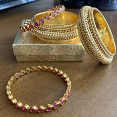 4 Indian Wedding Bracelets, Brand-New, Never Worn, Unfortunately Too Small For Me. Size 2x6 (Both), Copper Base With Gold-Plating, 2 Of Them With Ruby Czs. Wedding Jeweled Bangle, Elegant Festive Stackable Jewelry, Gold Ruby Stackable Jewelry, Ruby Jeweled Bangle For Wedding, Ruby Bangle For Wedding, Formal Temple Jewelry Bridal Sets, Gold Ruby Bracelets For Wedding, Gold Ruby Bangle, Red Jeweled Bangle For Wedding