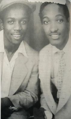 two young men are posing for a photo