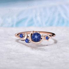 Star Blue Sapphire Engagement Ring Unique 5mm Round Star Blue Wedding Rings Rose Gold Celestial Moon Blue Sapphire Ring Unique Promise Gifts The waning moon is believed to be a good time for clearing negative influences. This simple, ready to wear ring allows you to keep the spirit of the moon with you always. The moon engagement rings are a popular choice, represents I LOVE YOU TO THE MOON AND BACK , used to express the vastness of one's affection for another. 30 days non-hassle return policy. Celestial Ring Wedding, Elegant Blue Star-shaped Jewelry, Celestial Blue Sapphire Promise Ring, Blue Celestial Sapphire Promise Ring, Celestial Style Round Sapphire Ring, Celestial Sapphire Wedding Ring, Celestial Style Sapphire Wedding Ring, Blue Star-shaped Celestial Jewelry, Celestial Blue Star-shaped Jewelry