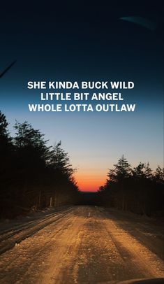 a road with the words she kinda buck wild little bit angel whole lota out law